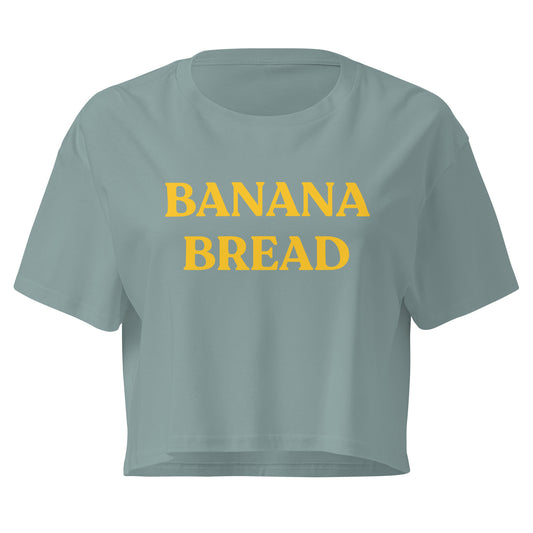 Mineral green color crop top t-shirt with Banana Bread printed on the front in yellow writing.
