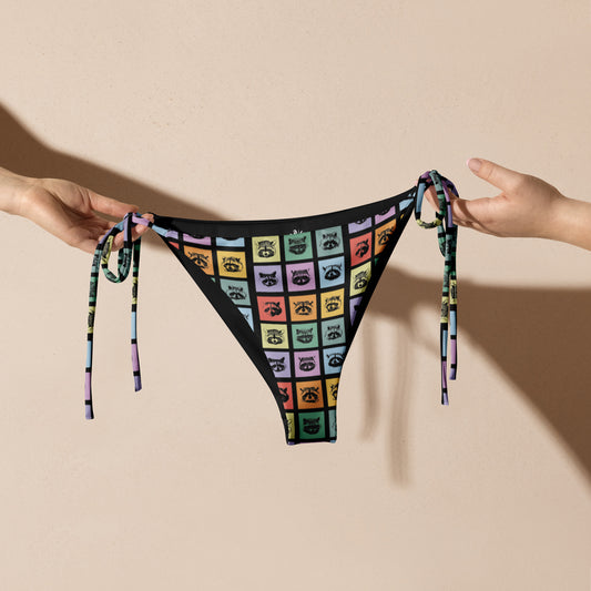 Love raccoons? Looking for your new favorite eco friendly bikini? Sit back and relax by the poolside wearing this classic string bikini with a colorful raccoon design. Our raccoon bikini is made of soft and stretchy recycled polyester with UPF 50+. Perfect for the beach, the pool and everything in between, or a funny gift for a raccoon enthusiast!