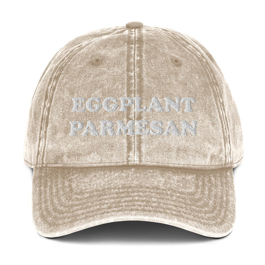 Beige eggplant parmesan dad hat - An eggplant parmesan hat for foodies and Italian food enthusiasts. Celebrate eggplant parm in this funny embroidered dad hat. It's a unique foodie hat that's made just for you. Share your love for eggplant parmesan in this random statement dad hat or give it as a funny gift for foodie or eggplant lovers of all kinds.