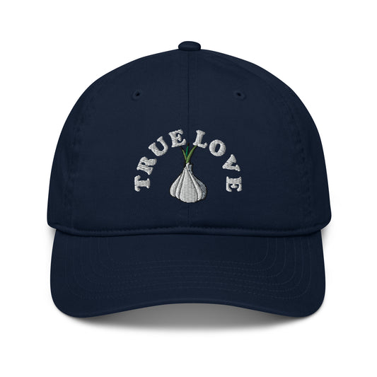 The 'True Love' garlic hat is perfect for foodies and garlic addicts. If you love garlic, it's time to show it in this funky and unique dad hat. The eco friendly garlic hat is cute, unusual and 100% organic cotton. Funky fashion, foodie beanies, garlic hats, weird vegan clothing and more. Unique designs for everyone.