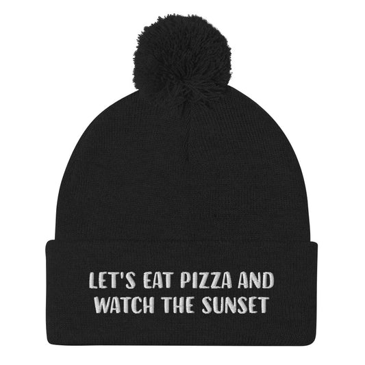 Black watch the sunset beanie for pizza lover - Let's eat pizza and watch the sunset in a unique beanie with a funny message. This cute beanie is a warm hat for cozy nights in and outdoor adventures. It's a classic unisex embroidered beanie with a pom pom on top. Love sunsets and pizza? Wear this funny foodie beanie or give it as a unique gift for pizza lovers.