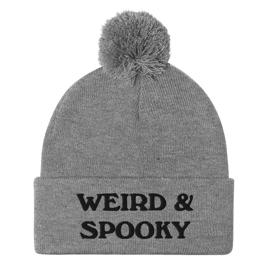 Gray and black weird and spooky beanie - Stay weird and spooky in this classic beanie with a pom pom on top. It's cute and cozy and just a little weird. So, celebrate your weirdness and individuality in our funky clothing and accessories. Be weird, be spooky, and be yourself in these colorful and unique beanies.