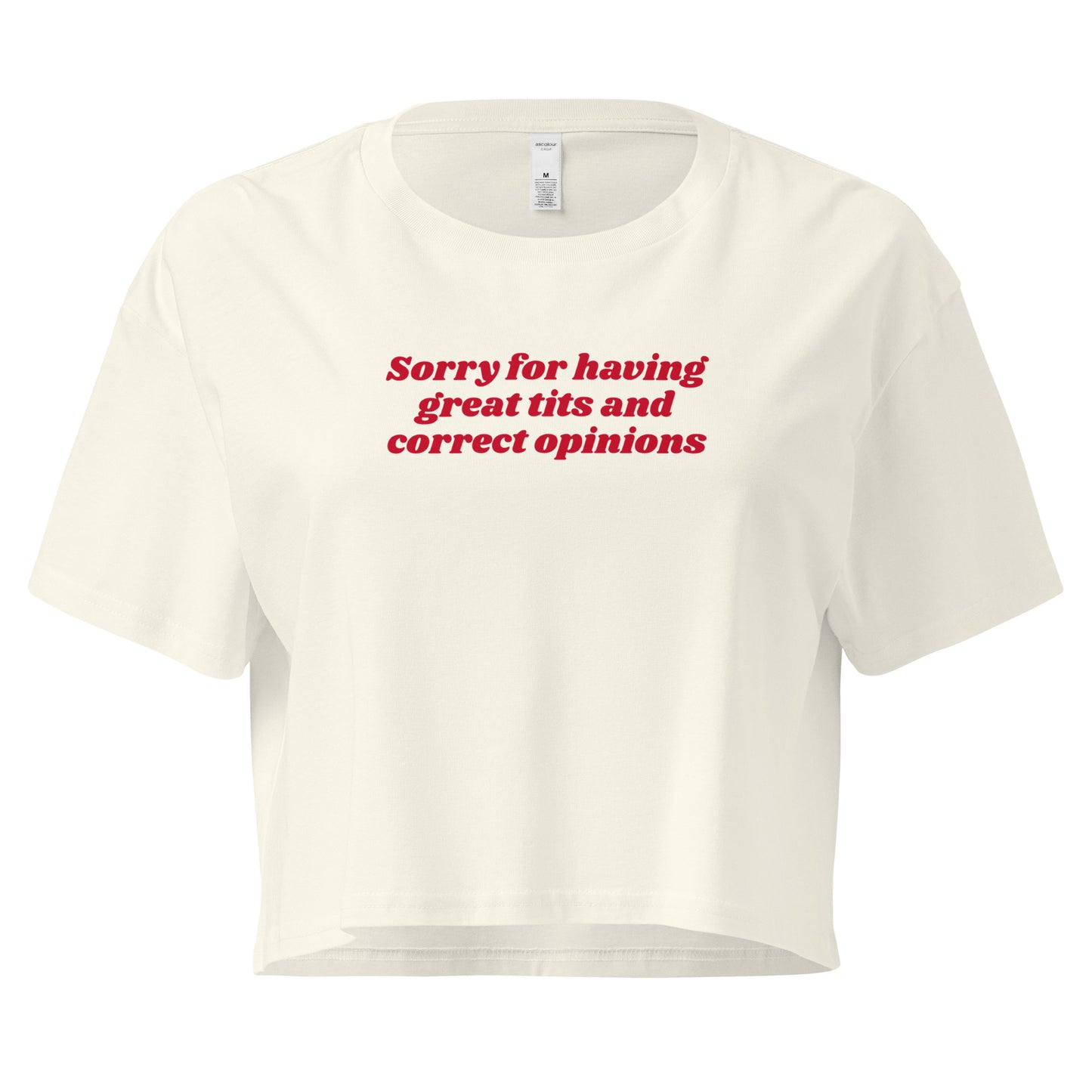 Natural crop t-shirt with the text 'Sorry for having great tits and correct opinions' printed in red on the front.
