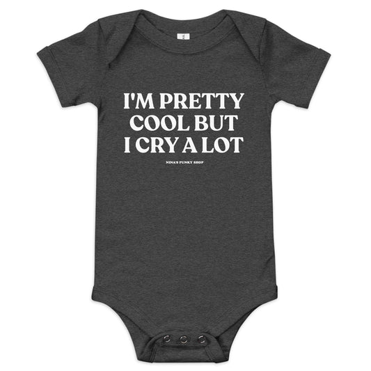 Dark Gray I'm Pretty Cool But I Cry A Lot Baby Onesie - Dress your baby in our 100% cotton I'm Pretty Cool But I Cry A Lot Onesie. It has three snap leg closure for easy changing, a comfortable envelope neckline, and a sarcastic saying, expertly printed on the front. This funny baby onesie is designed by Nina and made just for you! 