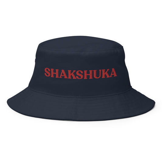 Navy Shakshuka Bucket Hat - Our Shakshuka Bucket Hat is made of 100% cotton and made just for you. It's a classic bucket hat with a funny food design, expertly embroidered on the front. It makes a great gift for shakshuka lovers and a unique everyday hat for foodies of all kinds. Celebrate your favorite foods in our funky foodie clothing and accessories.