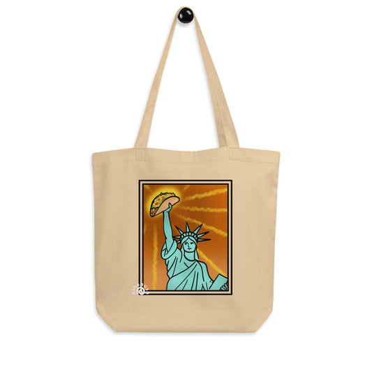 Tan funny new york tote bag - This Statue of Liberty taco lover tote bag is perfect for all taco enthusiasts, New Yorkers and foodies of all kinds. It's a classic tote bag with a unique Statue of Liberty holding a taco. The funny New York foodie design is bright and colorful and the organic cotton tote bag is perfect for everyday adventures. 