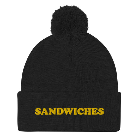 Black Foodie Beanie - Love sandwiches? This sandwich hat is just for you! It's a warm and cozy beanie with a classic pom pom on top and "sandwich", expertly embroidered on the front. Designed by Nina and made just for you! Looking for something personalized? A different embroidery color? Shoot us an email or check out our customizable apparel! 