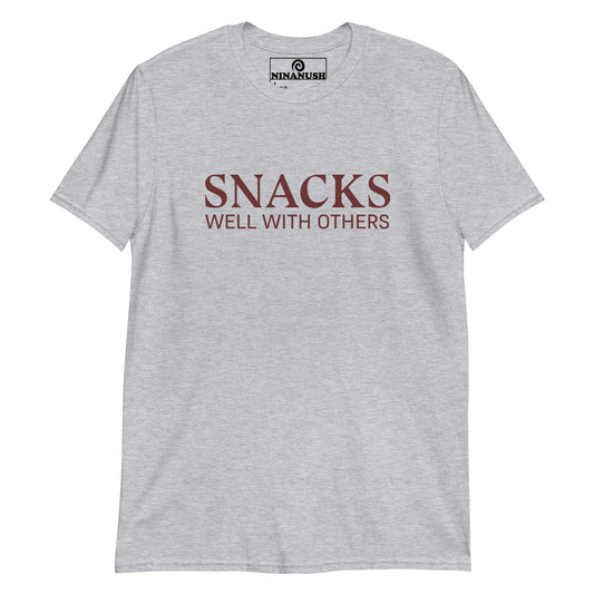 Gray funny snack shirt for social eaters - Snacks well with others! A classic cotton tee with a funny snack lover saying on the front. This funny food t-shirt is designed for snack enthusiasts and made just for you. Embrace your inner snack monster and let your passion shine with this eye-catching social snacker graphic tee. Eat snacks in our funny snack tee.