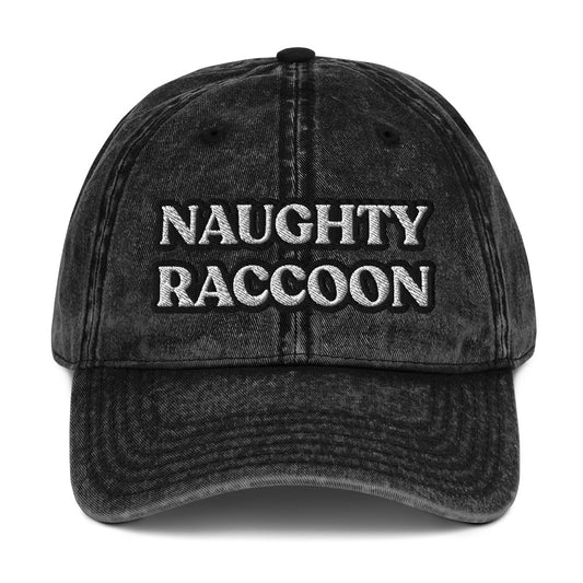 Black vintage style dad hat from Nina's Funky Shop by ninanush - Stand out in this naughty raccoon hat. It's a vintage style embroidered dad hat with the words "naughty raccoon" in black and white on the front. This unique hat for raccoon enthusiasts is funny and just a little weird. Add a little personality to your everyday style or give it as a funny gift for a raccoon lover.