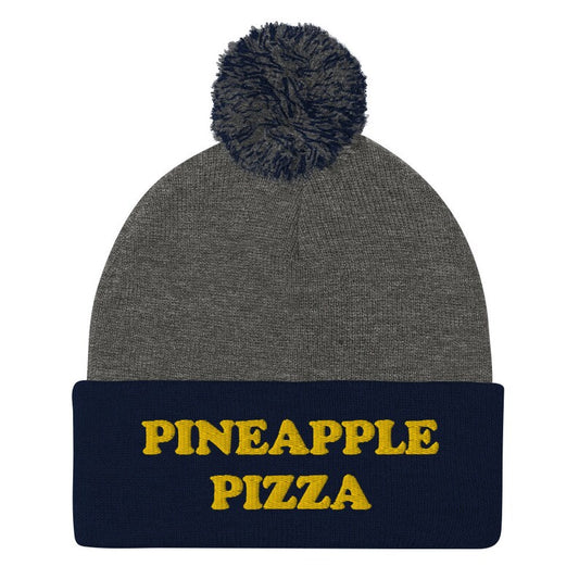 Navy blue and gray pineapple pizza beanie -Are you in the pineapple pizza club? Eat pineapple pizza in style in a funny foodie beanie for pizza lovers. It's a unisex embroidered beanie for pineapple pizza enthusiasts. If you love pineapple pizza, this weird foodie hat is a must have or give this warm and cozy hat as a funny gift for pineapple pizza people. 